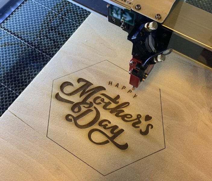 Laser system engraving wood